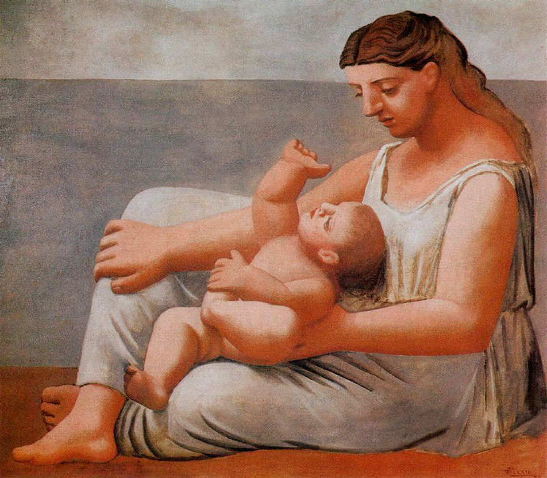 Woman with child on the seashore